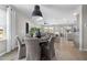 Elegant dining area with a round table, upholstered chairs, and an open floor plan at 512 Providence Springs Ln, Fuquay Varina, NC 27526