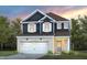 Charming two-story home with brick accents, a two-car garage, and a welcoming front entrance at 512 Providence Springs Ln, Fuquay Varina, NC 27526