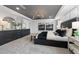 This main bedroom has an accent wall, grey carpet, and a large dresser with matching decorations and lighting at 512 Providence Springs Ln, Fuquay Varina, NC 27526