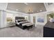 Serene primary bedroom with a tray ceiling, elegant decor, and ample natural light at 512 Providence Springs Ln, Fuquay Varina, NC 27526