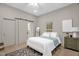 Bright bedroom featuring a barn door to the bathroom, and stylish decor at 516 Ottawa Ave, Durham, NC 27701