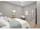 Bright bedroom with neutral decor, stylish furnishings and a window providing natural light at 516 Ottawa Ave, Durham, NC 27701