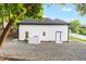 The exterior view showcases the back of the home with gravel landscaping and black accents at 516 Ottawa Ave, Durham, NC 27701