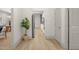 Bright hallway leads to an open-concept kitchen with modern appliances and seamless flow throughout the home at 516 Ottawa Ave, Durham, NC 27701