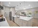 Bright kitchen features an island with white marble countertop and modern stainless steel appliances at 516 Ottawa Ave, Durham, NC 27701