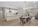 Open concept featuring a kitchen with an island overlooking the dining and living area, great for entertaining guests at 516 Ottawa Ave, Durham, NC 27701