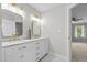 Bathroom with a double sink vanity, marble countertops, and modern fixtures at 5301 Night Heron Dr, Wake Forest, NC 27587