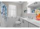 Bathroom with a shower/tub combo, white subway tile, and floral shower curtain at 5301 Night Heron Dr, Wake Forest, NC 27587