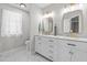 Bathroom with a double sink vanity, marble countertops, and modern fixtures at 5301 Night Heron Dr, Wake Forest, NC 27587