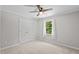 Neutral bedroom with a window and closet at 5301 Night Heron Dr, Wake Forest, NC 27587