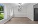 Formal dining room with hardwood flooring, updated light fixture, and natural light at 5301 Night Heron Dr, Wake Forest, NC 27587