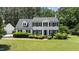 Charming two-story home with a landscaped lawn, dormer windows, and black shutters at 5301 Night Heron Dr, Wake Forest, NC 27587