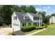 Two-story home with attached garage, manicured landscaping, and a well-maintained lawn at 5301 Night Heron Dr, Wake Forest, NC 27587