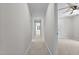 Hallway with neutral paint and carpet leading to bright rooms with windows at 5301 Night Heron Dr, Wake Forest, NC 27587