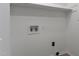 Laundry room with storage shelf and hookups at 5301 Night Heron Dr, Wake Forest, NC 27587