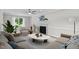 Cozy living room with plush seating, marble fireplace, and a view of the backyard at 5301 Night Heron Dr, Wake Forest, NC 27587