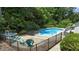 Relaxing pool area with hot tub, lounge chairs, and fire pit, perfect for entertaining at 5301 Night Heron Dr, Wake Forest, NC 27587