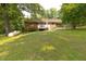 Enjoy the huge backyard with a deck, storage shed, and a large propane tank at 5504 Balsam Pl, Raleigh, NC 27603