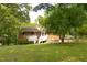 The backyard features a deck, luscious yard and a covered parking space at 5504 Balsam Pl, Raleigh, NC 27603