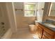 Bathroom featuring a tiled shower-tub combination and updated vanity with countertop at 5504 Balsam Pl, Raleigh, NC 27603