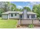 Lovely backyard featuring a deck, perfect for entertaining or relaxing outdoors at 5617 Groomsbridge Ct, Raleigh, NC 27612