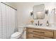 Modern bathroom featuring updated vanity, sleek fixtures, and elegant mirror at 5617 Groomsbridge Ct, Raleigh, NC 27612