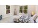Bright bedroom with large windows offering picturesque views of the surrounding greenery at 5617 Groomsbridge Ct, Raleigh, NC 27612