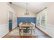Classic dining room offers a perfect space for gatherings with natural lighting at 5617 Groomsbridge Ct, Raleigh, NC 27612