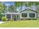 Charming single-story home featuring a well-manicured lawn and inviting front porch at 5617 Groomsbridge Ct, Raleigh, NC 27612