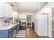 Bright kitchen showcases classic appliances and white cabinets with stylish countertops at 5617 Groomsbridge Ct, Raleigh, NC 27612