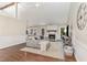 Cozy living room features a fireplace, hardwood floors, and ample natural light at 5617 Groomsbridge Ct, Raleigh, NC 27612