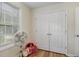 Bedroom featuring a window with blinds and a closet with double doors at 5817 Seward Dr, Knightdale, NC 27545