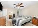Cozy bedroom with ceiling fan, carpet flooring, and a full length mirror that creates an open feel at 5817 Seward Dr, Knightdale, NC 27545