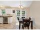 The dining area features a wooden table with seating and is adjacent to the kitchen and sliding patio doors at 5817 Seward Dr, Knightdale, NC 27545
