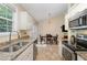 This kitchen features stainless steel appliances, granite countertops, and a dining area for casual meals at 5817 Seward Dr, Knightdale, NC 27545