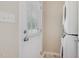 Bright laundry room with a full size washer and dryer unit and access to the backyard at 5817 Seward Dr, Knightdale, NC 27545