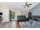 Cozy living room with hardwood floors, ceiling fan, and comfortable seating at 5817 Seward Dr, Knightdale, NC 27545