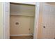 A walk-in closet features wire shelving and hookups for a washer and dryer at 5949 Sandy Run, Knightdale, NC 27545
