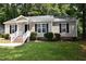 Charming single-story home with a welcoming porch and well-maintained landscaping at 5949 Sandy Run, Knightdale, NC 27545