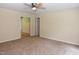 Inviting living room with neutral tones and a view into an adjacent room at 5949 Sandy Run, Knightdale, NC 27545