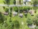 Ariel view of residential neighborhood with houses, lawns and mature trees at 6411 Pondview Ln, Durham, NC 27712