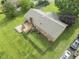 Aerial view of the home showcasing the large backyard, wooden deck, patio area and tree coverage at 6411 Pondview Ln, Durham, NC 27712