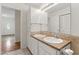 Bathroom includes a double vanity, bright lighting, and ample storage at 6411 Pondview Ln, Durham, NC 27712