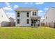 Expansive backyard showcasing a well-maintained lawn and the home's exterior at 6512 Bunker Hill Dr, Raleigh, NC 27610