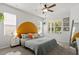 Bright bedroom featuring natural light and a modern accent wall at 6512 Bunker Hill Dr, Raleigh, NC 27610