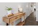 Stylish entryway with a wood console table, modern decor, and sleek flooring at 6512 Bunker Hill Dr, Raleigh, NC 27610