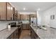 Modern kitchen boasts stainless steel appliances, granite countertops and wooden cabinets at 6512 Bunker Hill Dr, Raleigh, NC 27610