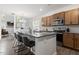 Kitchen and open-concept dining area featuring an island with seating and stainless steel appliances at 6512 Bunker Hill Dr, Raleigh, NC 27610