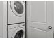 Stacked washer and dryer unit provide convenience and efficiency in the laundry area at 6512 Bunker Hill Dr, Raleigh, NC 27610
