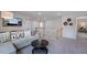 Loft area with couch, mounted TV, decorative wall art, and staircase at 668 Morning Glade St, Wake Forest, NC 27587